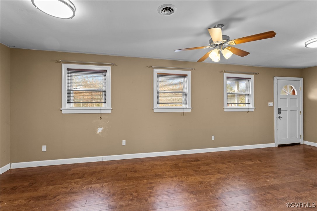 911 Maple Street Ashland, VA 23005 - Photo 11 of 35 a view of an empty room with wooden floor and a ceiling fan