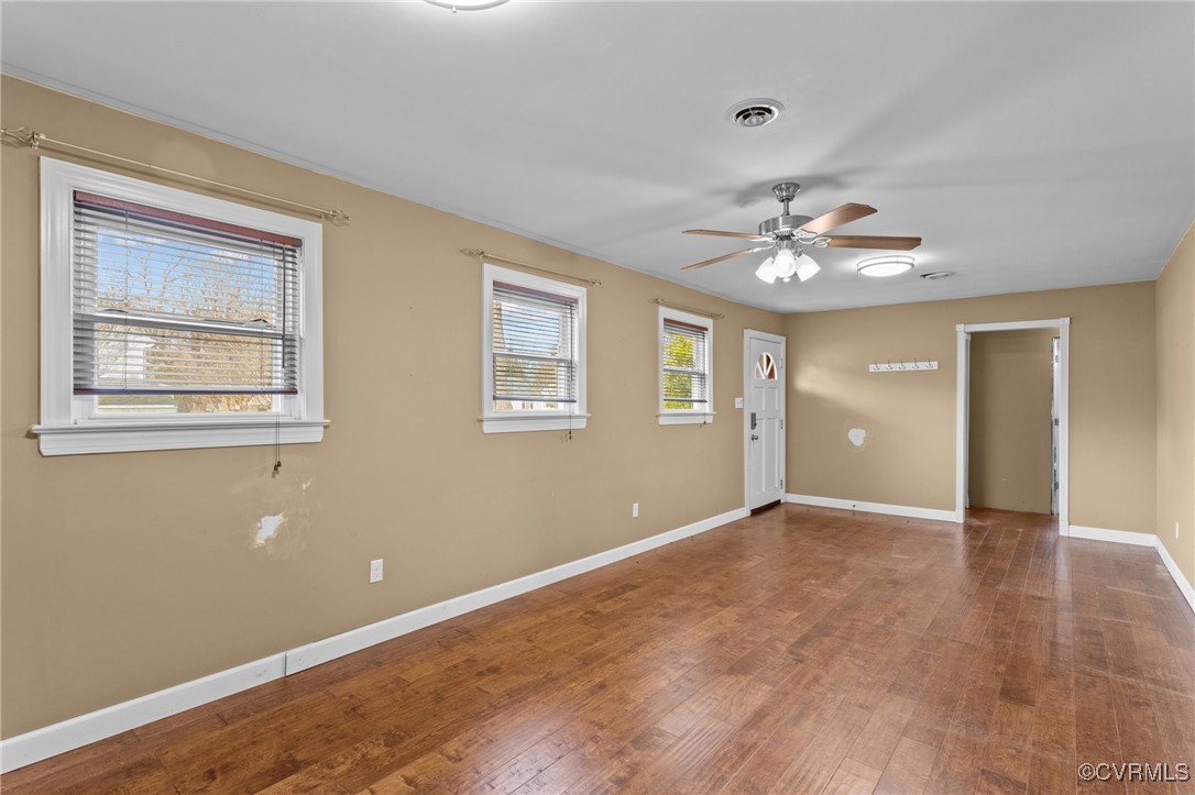 911 Maple Street Ashland, VA 23005 - Photo 12 of 35 a view of an empty room with a chandelier fan
