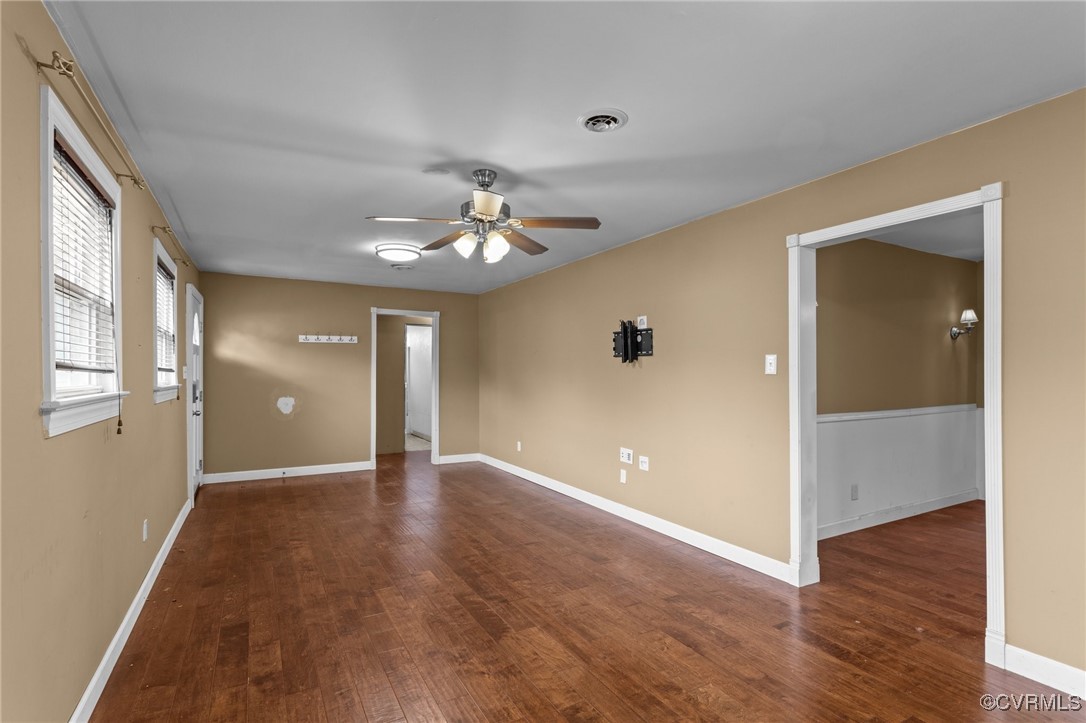 911 Maple Street Ashland, VA 23005 - Photo 13 of 35 a view of a hallway with wooden floor and chandelier