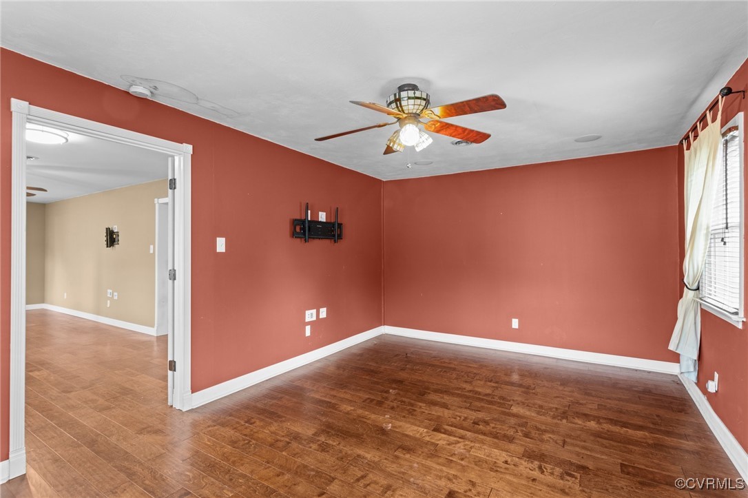 911 Maple Street Ashland, VA 23005 - Photo 16 of 35 wooden floor in an empty room with a window