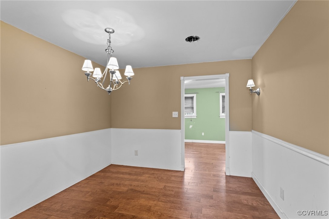 911 Maple Street Ashland, VA 23005 - Photo 18 of 35 a view of an empty room with wooden floor