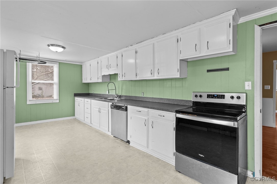 911 Maple Street Ashland, VA 23005 - Photo 19 of 35 a kitchen with cabinets a sink and a stove top oven