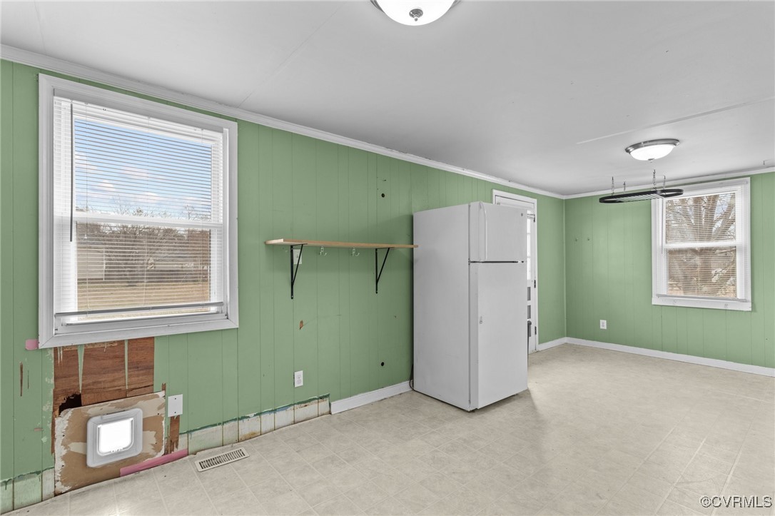 911 Maple Street Ashland, VA 23005 - Photo 20 of 35 an empty room with a window and a refrigerator
