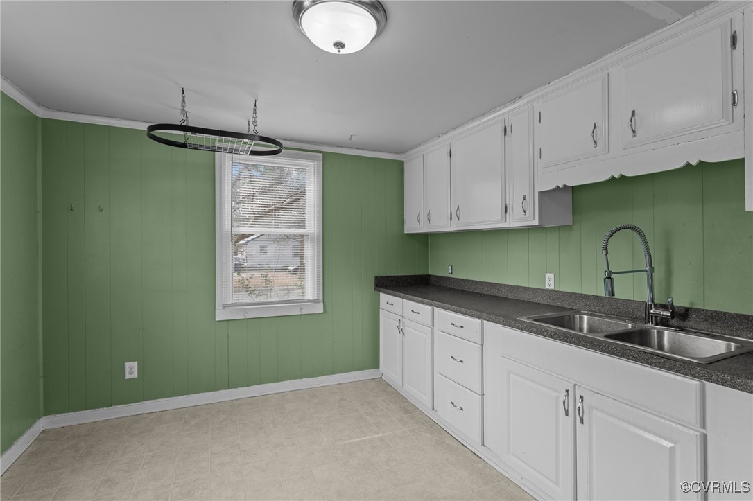 911 Maple Street Ashland, VA 23005 - Photo 21 of 35 a kitchen with white cabinets and a sink