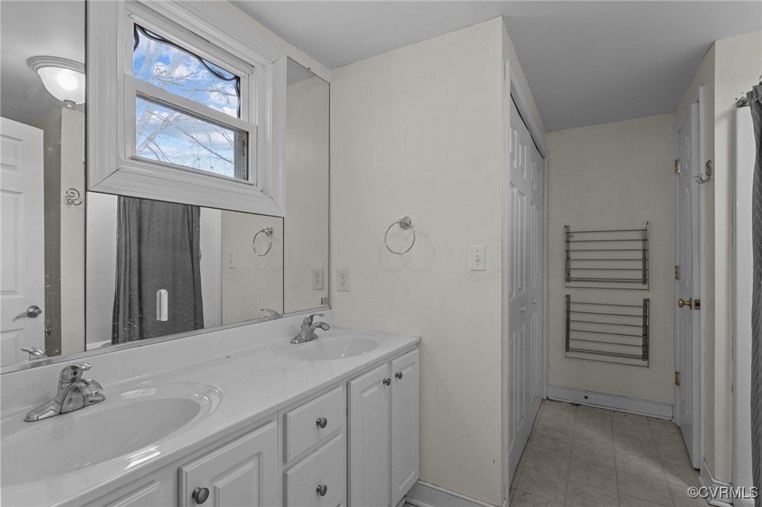 911 Maple Street Ashland, VA 23005 - Photo 27 of 35 a bathroom with a sink and a mirror