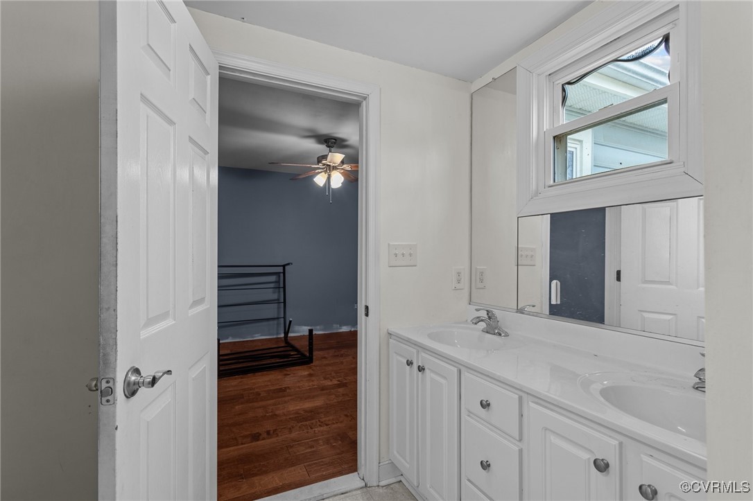 911 Maple Street Ashland, VA 23005 - Photo 28 of 35 a bathroom with a double vanity sink and a mirror