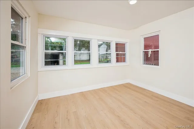 a view of an empty room with a window