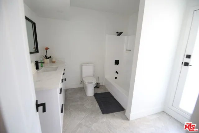 a bathroom with a sink and a toilet