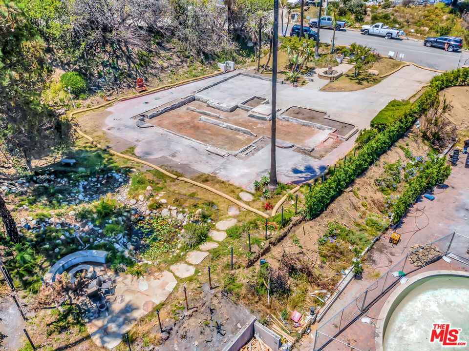 20434 Seaboard Road Malibu, CA 90265 - Photo 13 of 37 a view of a swimming pool with a patio