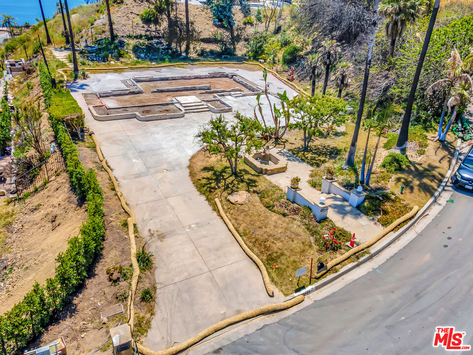 20434 Seaboard Road Malibu, CA 90265 - Photo 16 of 37 a view of a yard with a wooden fence