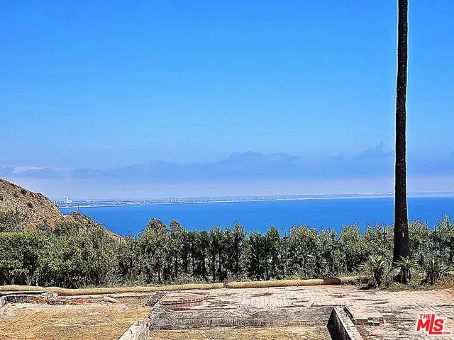 a view of a swimming pool with a yard