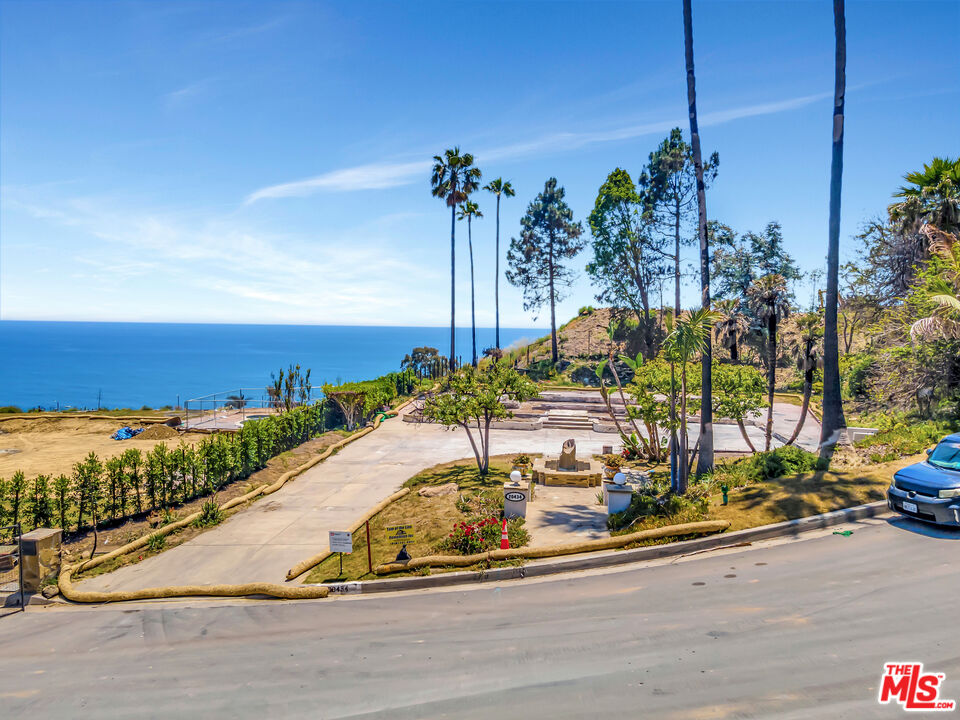 20434 Seaboard Road Malibu, CA 90265 - Photo 24 of 37 a view of a swimming pool with a yard