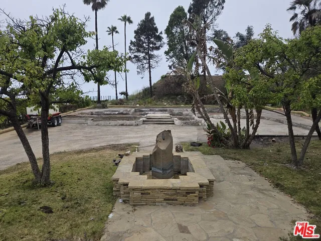 a view of a yard with a bench