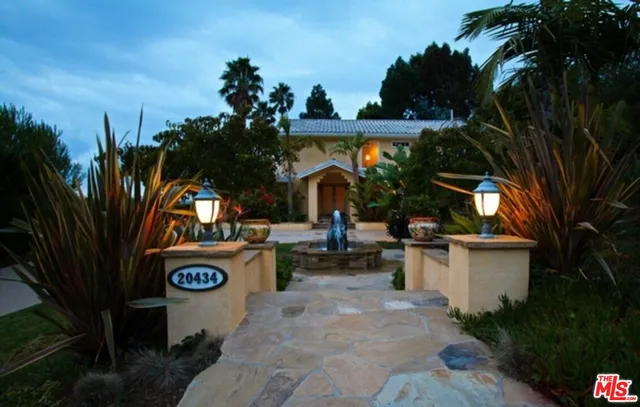 a view of a fire pit with flower plants