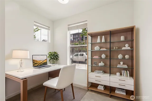 a living room with furniture and a lamp