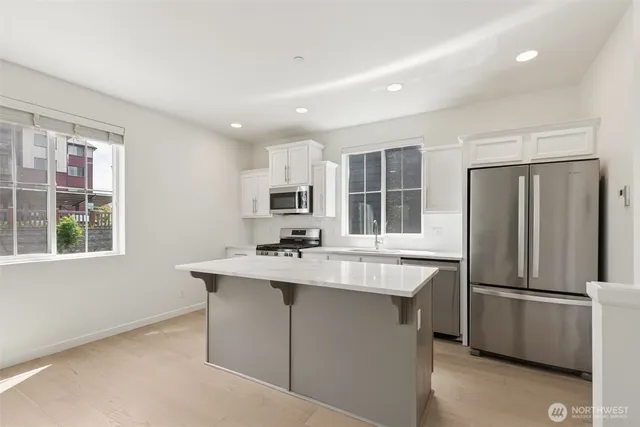 a view of a livingroom with a fireplace and window
