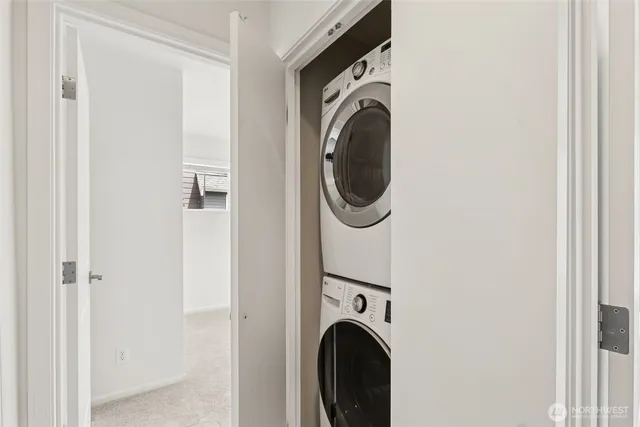 a close view of a utility room with dryer and washer
