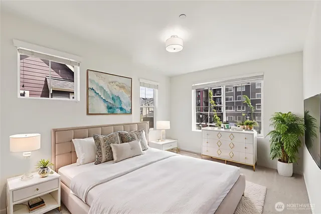 a bedroom with bed and a window