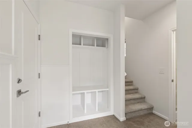 a view of a hallway with stairs