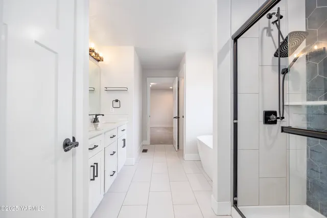 a bathroom with a double vanity sink toilet and shower
