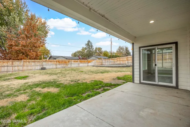 a view of a garden with an outdoor seating