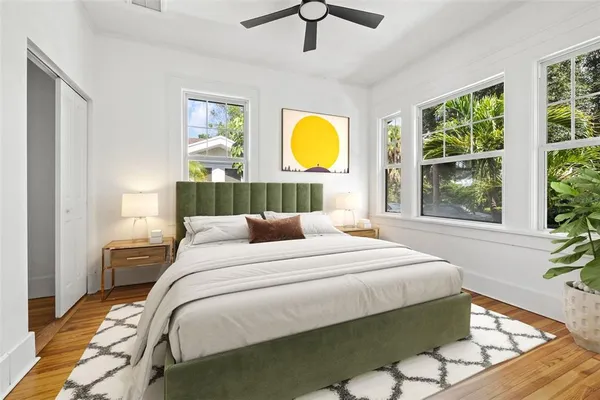 a bedroom with a bed and window