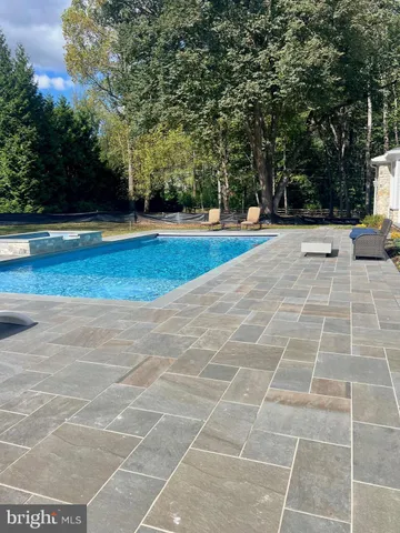 a kitchen with stainless steel appliances granite countertop a refrigerator and cabinets