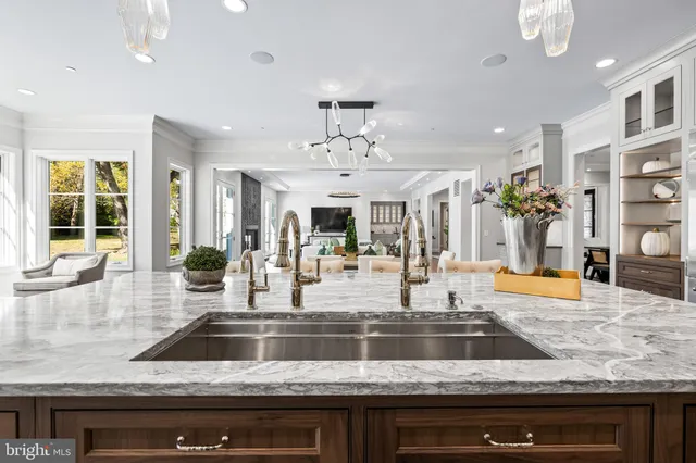 a bathroom with a granite countertop sink a toilet and a mirror