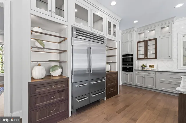 a living room with furniture couches and a fireplace