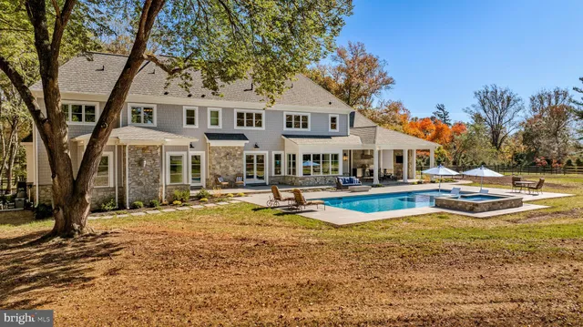 a view of a livingroom with furniture hardwood floor and a living room
