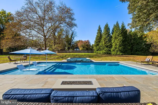a living room with fireplace furniture and a flat screen tv