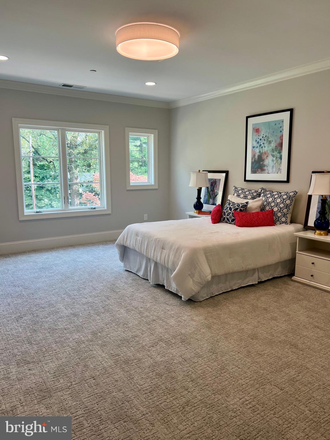 314 Golf Course Road Owings Mills, MD 21117 - Photo 60 of 112 a bedroom with a bed and a chandelier