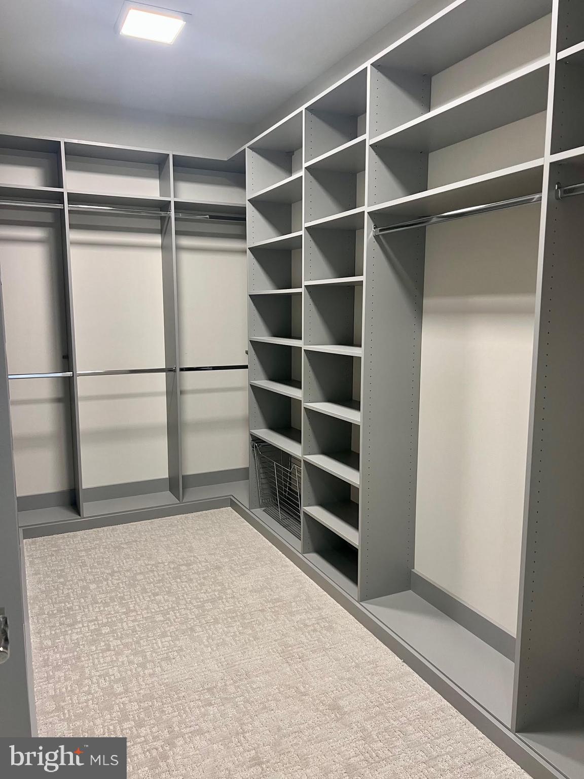 314 Golf Course Road Owings Mills, MD 21117 - Photo 63 of 112 a view of walk in closet with empty racks