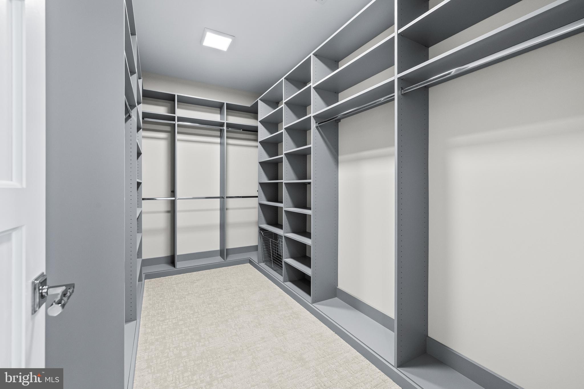 314 Golf Course Road Owings Mills, MD 21117 - Photo 77 of 112 a view of walk in closet with empty racks