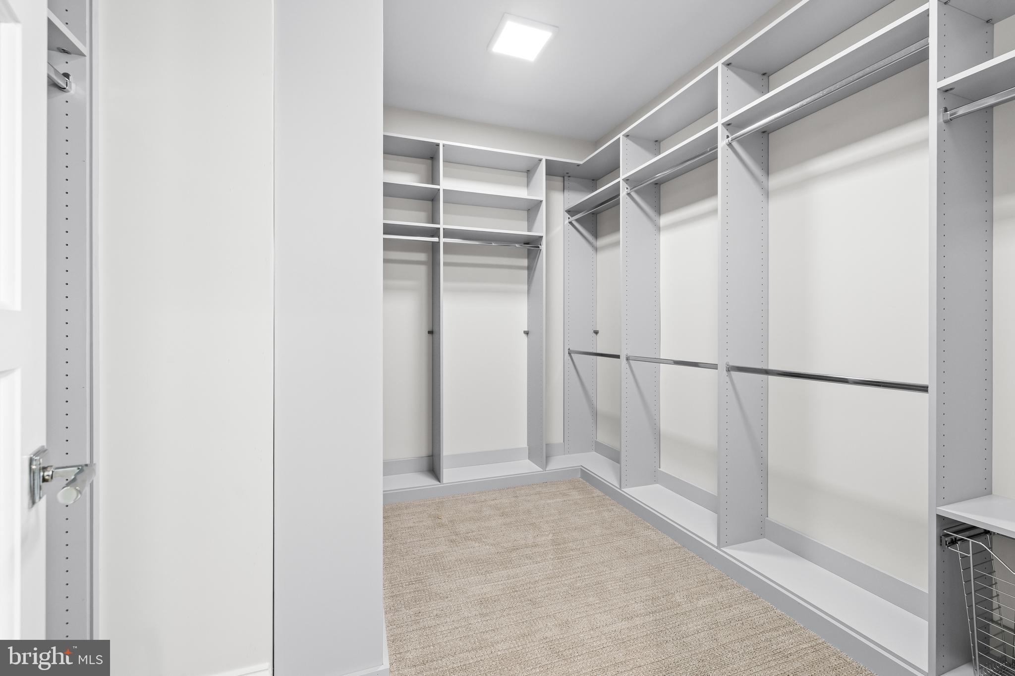 314 Golf Course Road Owings Mills, MD 21117 - Photo 85 of 112 a view of walk in closet with empty racks