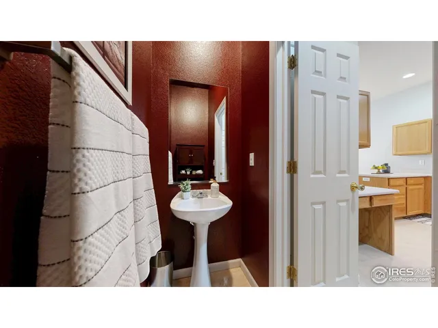 a bathroom with a sink double vanity mirror and a bathtub