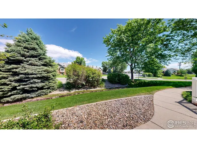 a view of a house with a yard and a large pool