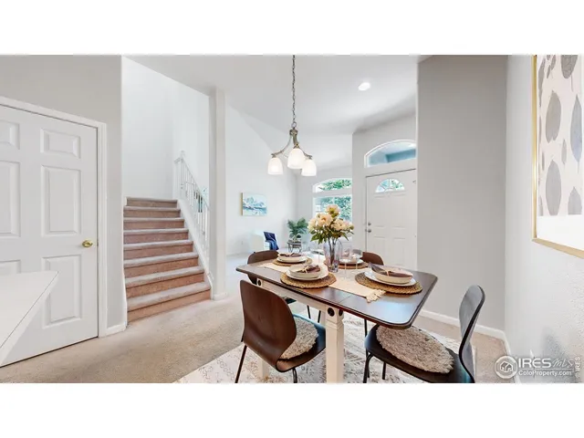 a kitchen with granite countertop a sink cabinets and window