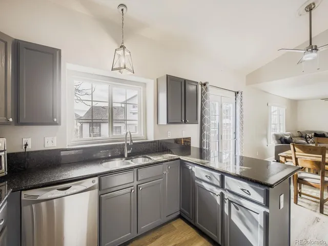 a kitchen with a sink and a window
