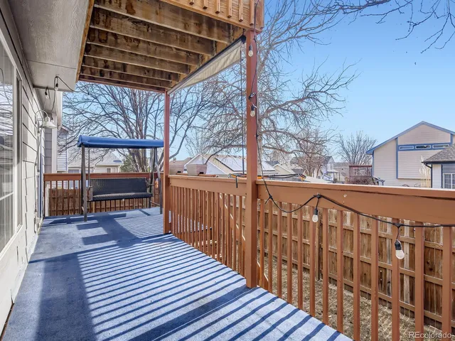 a balcony with wooden floor