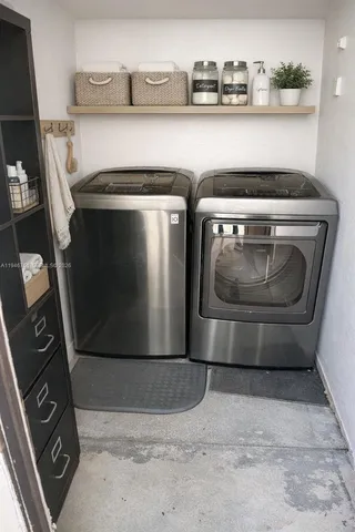 a utility room with dryer and washer