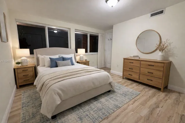 a bedroom with a bed and a dresser