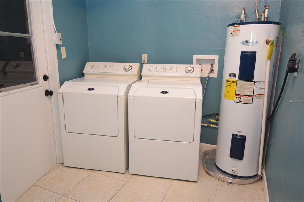 21572 Edgewater Drive Port Charlotte, FL 33952 - Photo 14 of 15 a utility room with dryer and washer