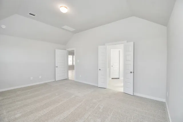 an empty room with closet area