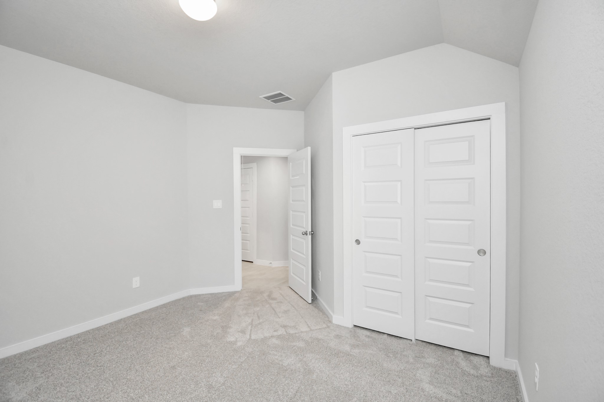 14619 Diamond Dove Lane Houston, TX 77049 - Photo 28 of 33 Generously sized secondary bedrooms featuring spacious closets, soft and inviting carpeting underfoot, large windows allowing plenty of natural light, and the added touch of privacy blinds for your personal retreat. Sample photo of completed home with similar floor plan. Actual colors and selections may vary.