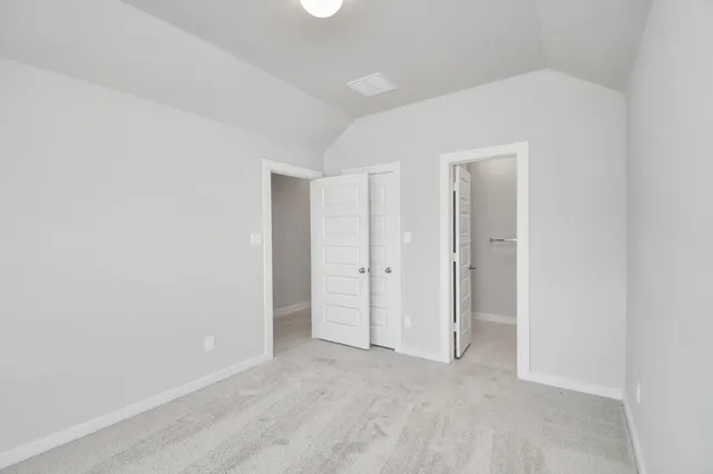 a kitchen with a sink a window and cabinets