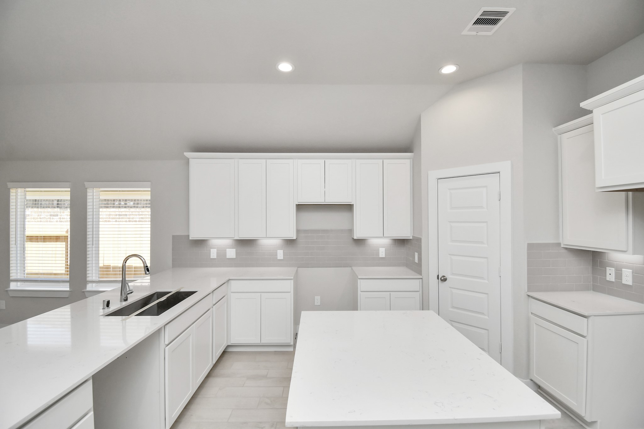 14619 Diamond Dove Lane Houston, TX 77049 - Photo 13 of 33 This kitchen is by far any chef’s dream! This spacious kitchen features high ceilings, white stained wood cabinets, granite countertop, SS appliances, modern tile backsplash, recessed lighting, extended counter space, granite kitchen island with, and a walk-in pantry all overlooking your huge family room. Sample photo of completed home with similar floor plan. Actual colors and selections may vary.