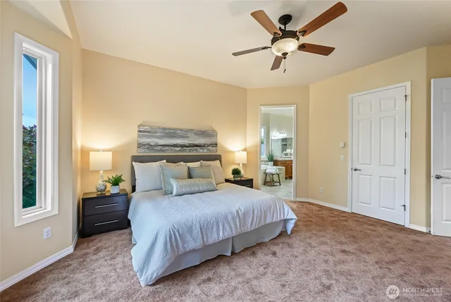 a bedroom with a bed and window