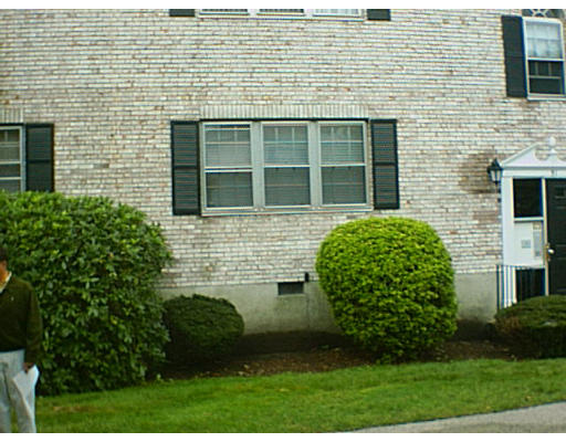 51 Lake Shore Road, Unit 1 Boston, MA 02135 - Photo 1 of 1 a view of a brick house with a garden
