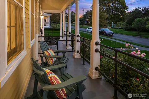 a view of an chairs and tables in the balcony